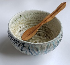 Soda-fired bowl with hand-carved spoon.