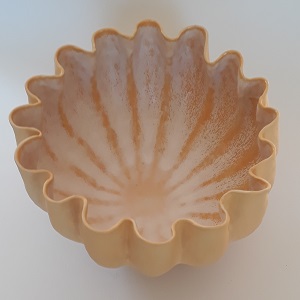 Fluted bowl with yellow slip.