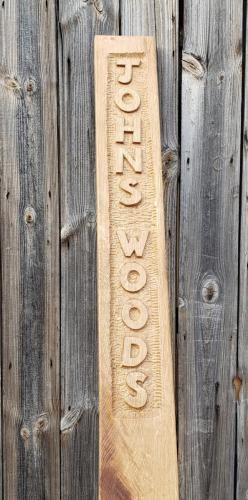 Woodland signpost in oak.