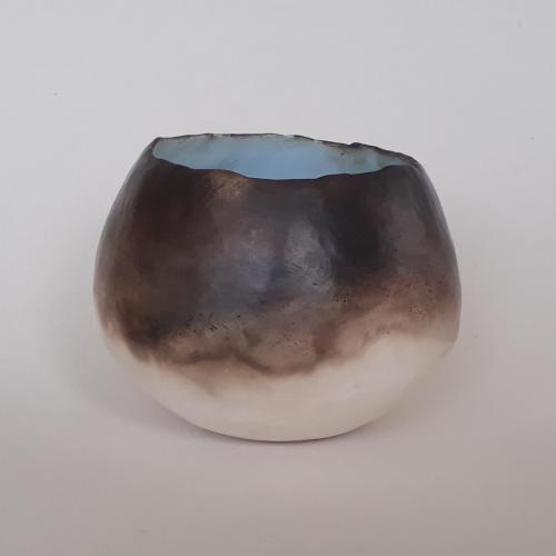 Small smoke-fired pot with blue slip inside by Karen George
